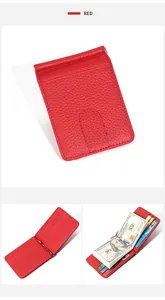 Macro shot of red pebble grain leather wallet featuring a silver metal money clip and card slots
