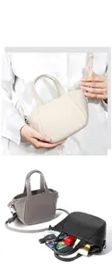 Detalle del bolso de cuero genuino con textura de lichi y cremallera metálica