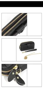 Detail of black lychee leather purse showing double zippers and gold chain strap