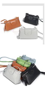 Macro shot of multiple colorful leather crossbody bags showing pebbled texture and metal zipper
