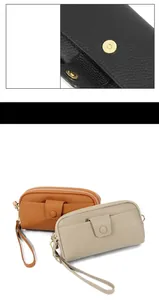 Detail view of double zipper pockets and magnetic buckle on genuine leather wallet bag
