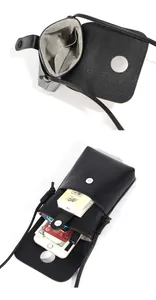 Detail van zwart kiezellederen telefoontasje met magneetsluiting en zachte stoffen voering