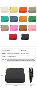 Détails du portefeuille en cuir de vachette grainé avec fermoir métallique circulaire
