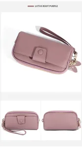 Detailed macro view of lotus root purple lychee grain leather wallet with gold hardware