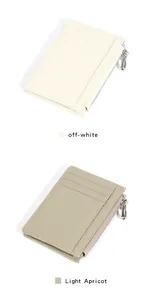 Detail view of leather card holders in off-white and light apricot with zipper pocket