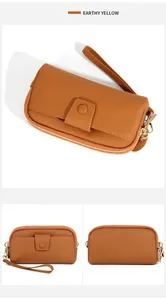 Detailed views of Earthy Yellow genuine leather long wallet with wristlet and front pocket