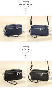 Dettaglio dei tre scomparti con zip e della pelle martellata della borsa a tracolla