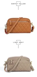 Detail of layered leather crossbody bags in earthy yellow and light gray with gold zippers