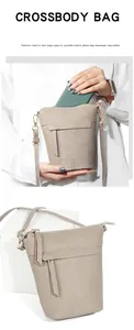 Detailaufnahme der hochwertigen Litschi-Lederstruktur und weißen Nähten der Eimertasche