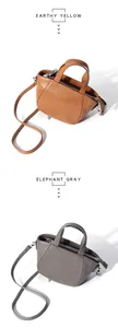 Comparativa detallada de bolsos de cuero granulado en amarillo tierra y gris elefante
