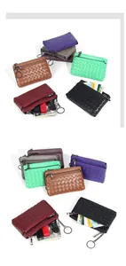 Detail showing woven sheepskin coin purses with keychains in various classic colors