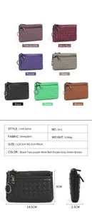 Detail view of woven sheepskin coin purses in multiple colors with gunmetal key ring