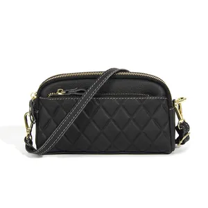 Black leather crossbody bag with quilted rhombic pattern and golden zippers