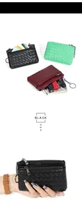 Detailed view of woven sheepskin coin purse with dual zippers and metal keychain