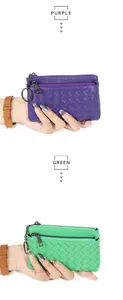 Detail of hand-woven sheepskin coin purse with key ring in purple and green leather