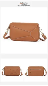 Detail view of yellowish brown leather bag featuring geometric stitching and gold hardware