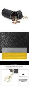 Gros plan sur la texture cuir noir de cette mini pochette avec fermeture éclair dorée