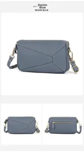 Detail of denim blue cowhide leather bag with geometric stitching and gold hardware