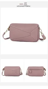Detail of lotus root purple leather crossbody bag with white stitching and back zipper pocket