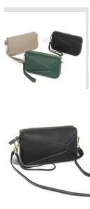 Detail of lychee textured leather bags with geometric stitching and gold zippers