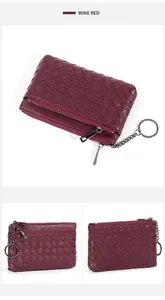 Macro shot of wine red woven sheepskin coin purse with dual zippers and key ring chain