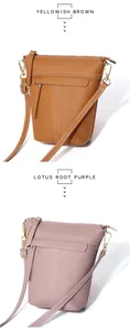 Details von Leder-Umhängetaschen in Gelbbraun und Lila mit goldenen Beschlägen