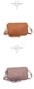 Detail view of genuine leather bags with geometric paneling and gold hardware