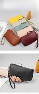 Detailed view of large capacity pebbled leather clutch wallets with wristlet straps