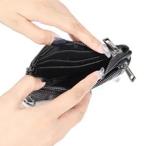 Handcrafted woven sheepskin coin purse with double zippers and metal keychain ring