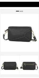 Detail of black lychee grain leather crossbody bag with white contrast stitching