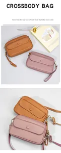 Detail of genuine top grain leather texture on chic crossbody bags in brown and pink