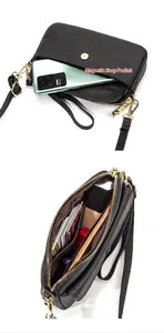 Detail of black pebbled leather crossbody bag with magnetic pocket and card slots