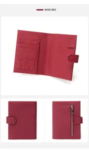 Detail of wine red pebble leather wallet with card slots, pen loop and zipper pocket