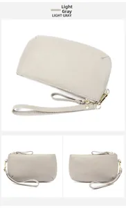 Detailed views of light gray lychee grain leather wallet with golden zipper and wristlet