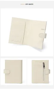 Detailed interior of off-white leather passport wallet with card slots and zipper pocket