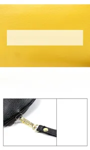 Close-up of yellow litchi grain cowhide leather texture with black edge and gold metal clasp