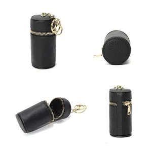 Mini pochette cylindrique en cuir noir avec porte-clés doré pour monnaie et écouteurs