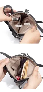 Detail view of leather phone bag interior showing main compartment and three card slots