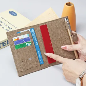 Brown leather travel passport holder with RFID blocking, card slots and pen loop