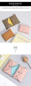 Detail of the litchi texture leather mini wallet with silver snap closure in pink