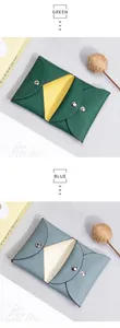Detail of genuine pebble leather coin purse showing metal snap closure and contrast colors