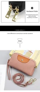 Detalle del bolso de cuero lichi rosa con herrajes dorados y cremallera de alta calidad