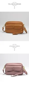 Detail view of lychee texture leather bags in yellowish brown and lotus root purple colors