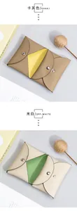 Detail of genuine lychee leather mini wallets with metal snap closures in dual-color design