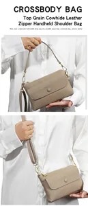 Détail de la texture en cuir de vachette grainé et de la fermeture éclair métallique du sac
