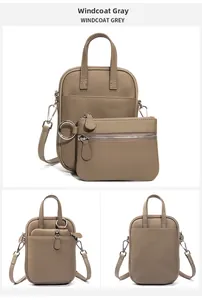 Detailed view of grey pebble leather crossbody phone bag with detachable small pouch