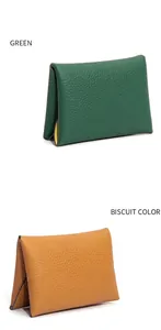 Front view of mini cowhide leather coin purses in textured green and biscuit colors