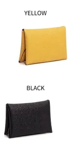 Detail of genuine cowhide leather coin purse with contrast edge and lychee texture