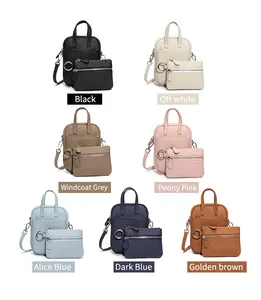 Matrix display of leather crossbody phone bags in seven colors with pebble grain texture