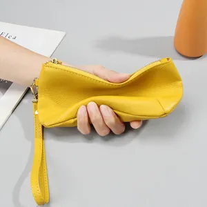 Bright yellow soft leather wristlet clutch bag with large capacity and zip closure